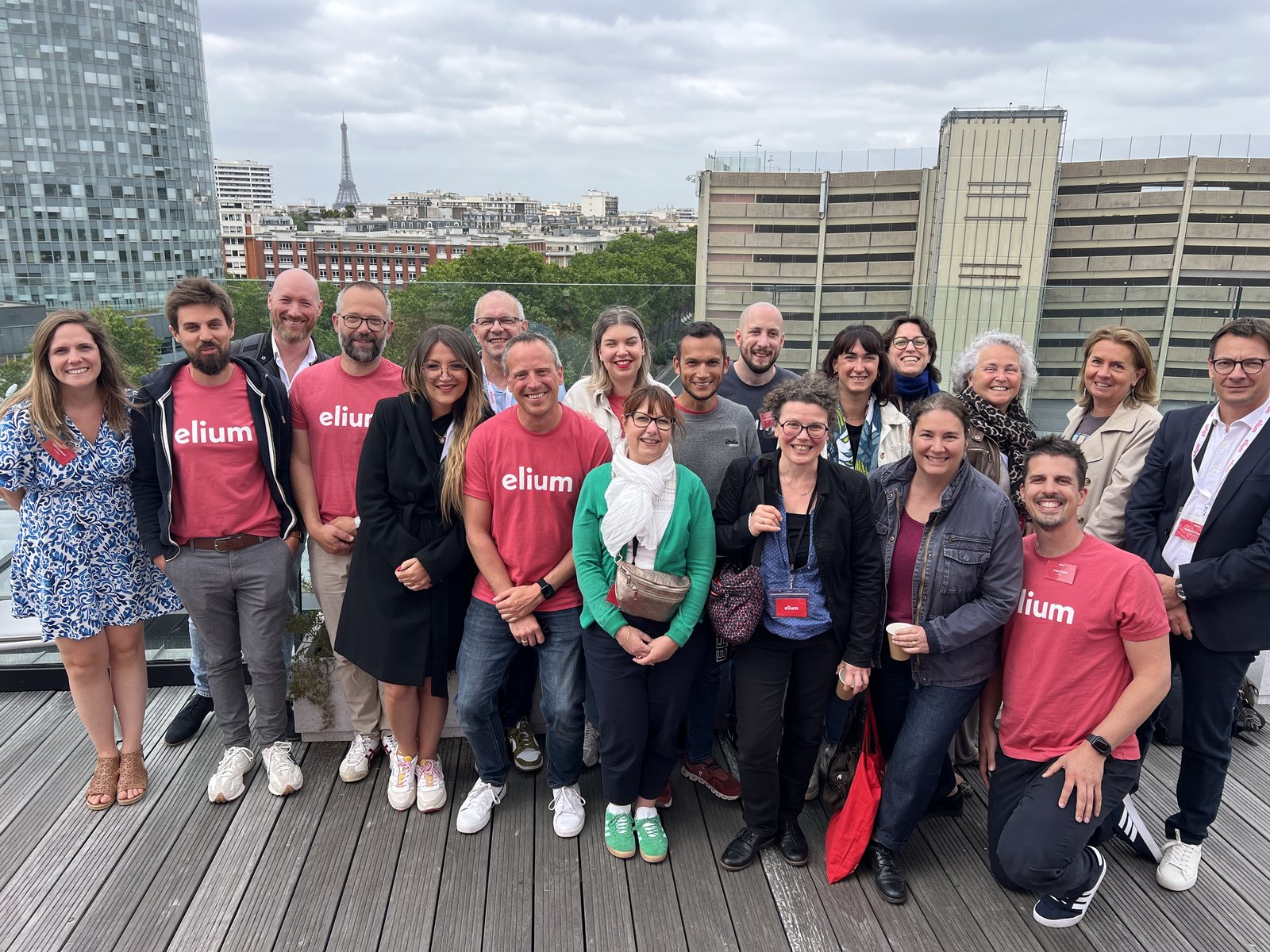 The team on a rooftop in Paris, the Eiffel Tower behind