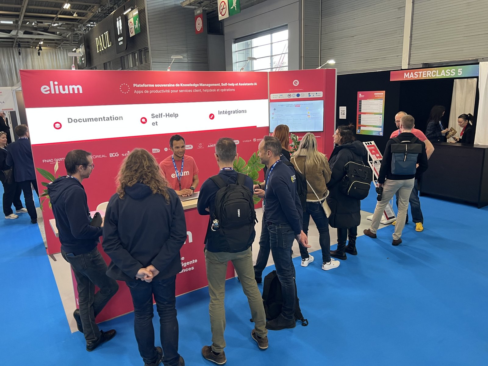 Visitors at the Elium stand during a trade show